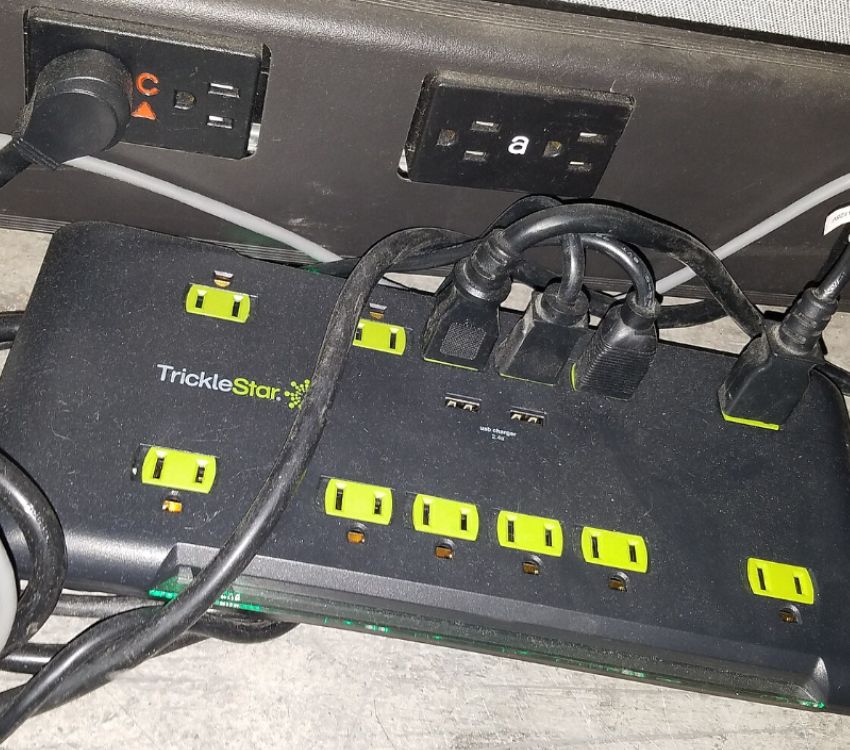 Gaming Consoles Plugged Into Cheap Surge Protectors 